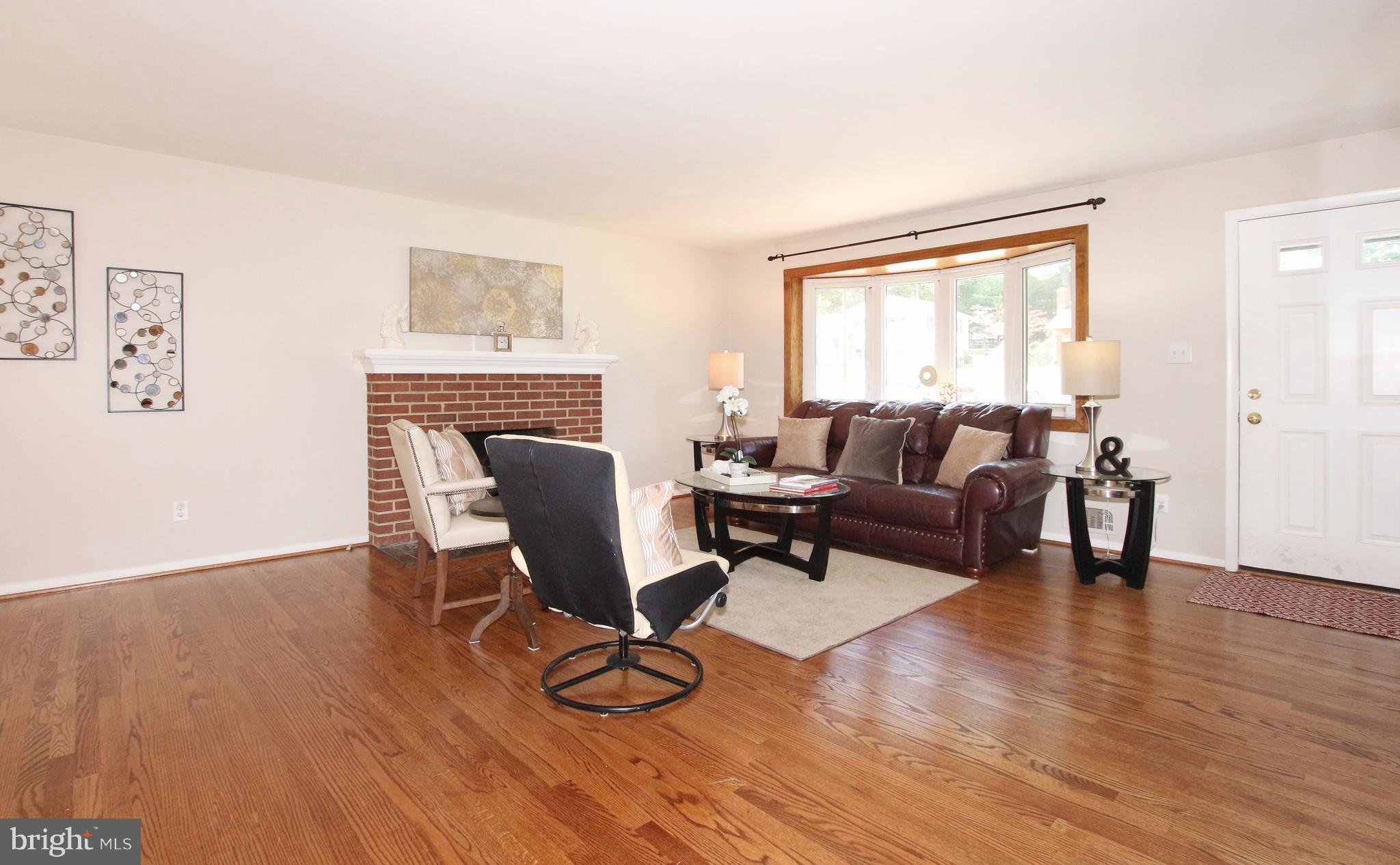 5300 Ravensworth Road Springfield, VA 22151 - Photo 11 of 28 a living room with furniture and a wooden floor