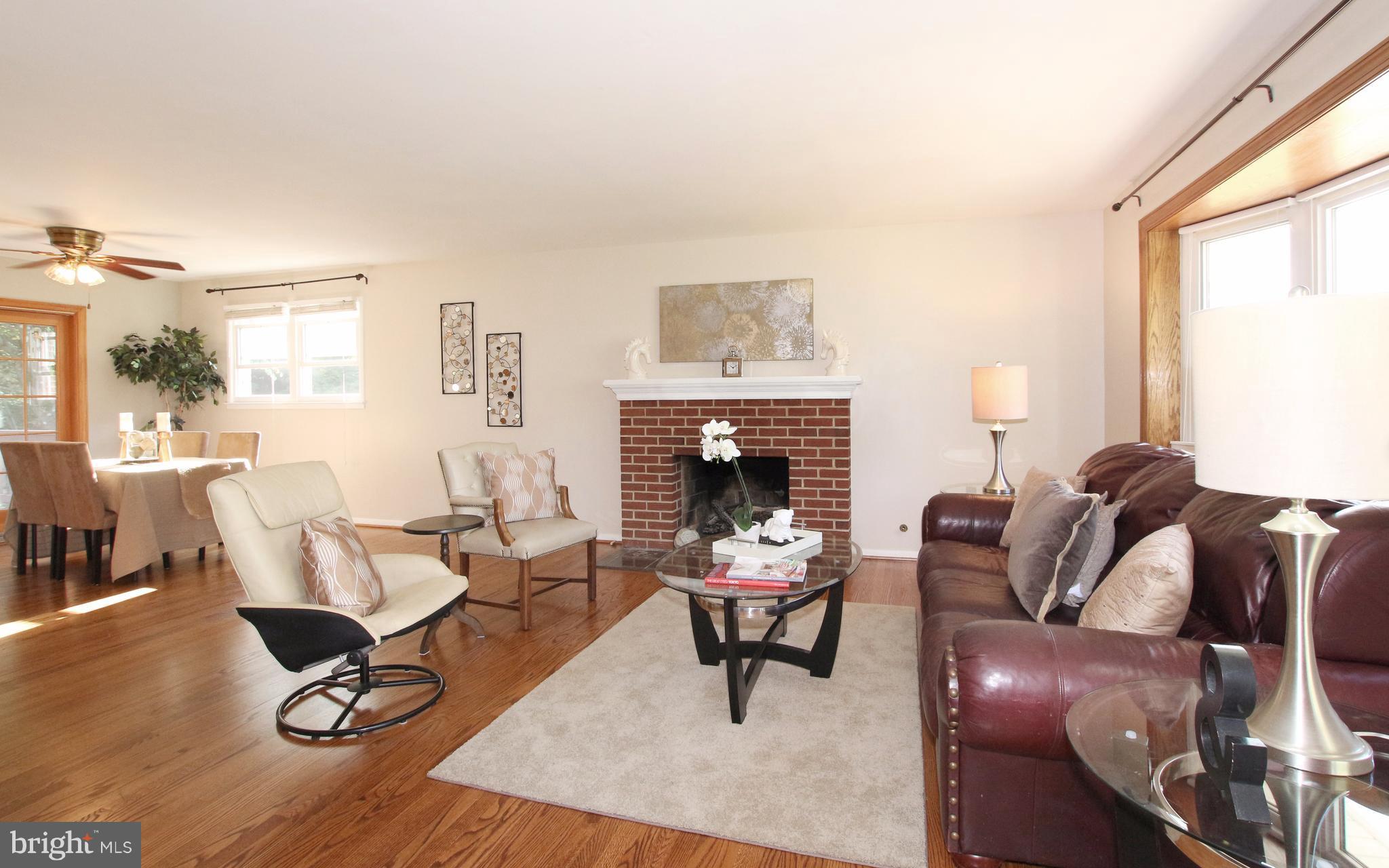 5300 Ravensworth Road Springfield, VA 22151 - Photo 12 of 28 a living room with furniture and a fireplace