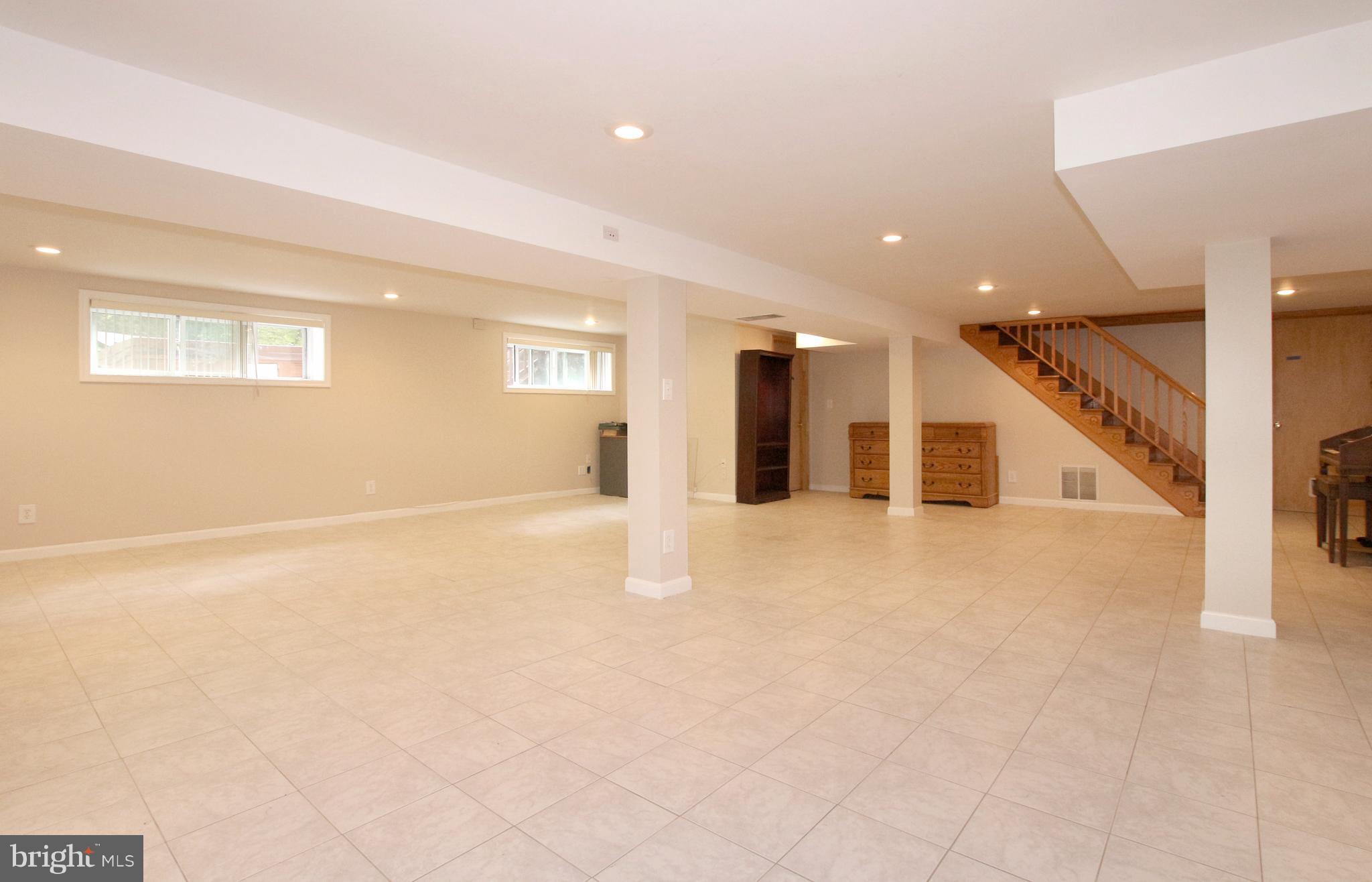 5300 Ravensworth Road Springfield, VA 22151 - Photo 21 of 28 a view of an empty room with wooden floor
