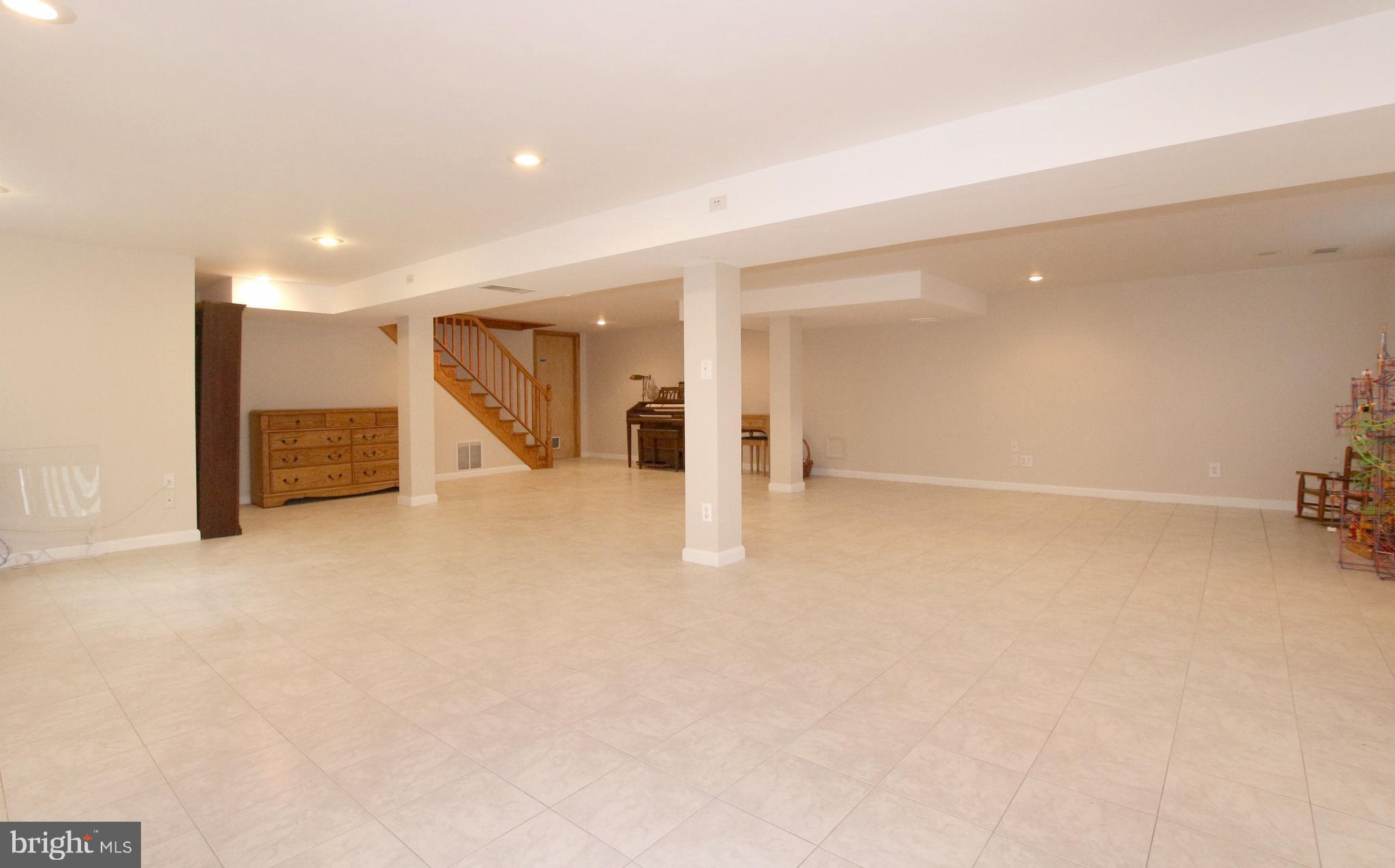 5300 Ravensworth Road Springfield, VA 22151 - Photo 22 of 28 a view of a livingroom with a staircase