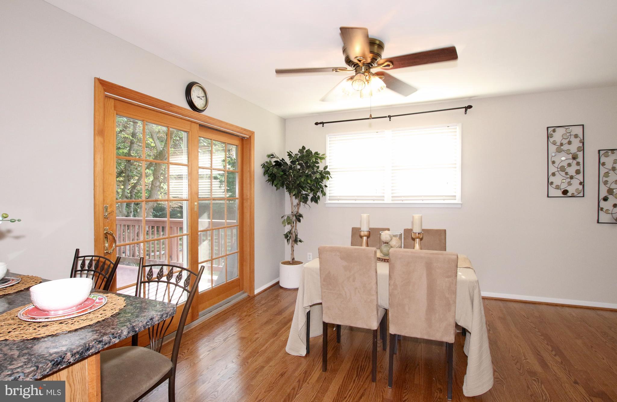 5300 Ravensworth Road Springfield, VA 22151 - Photo 7 of 28 a view of a dining room with furniture window and wooden floor