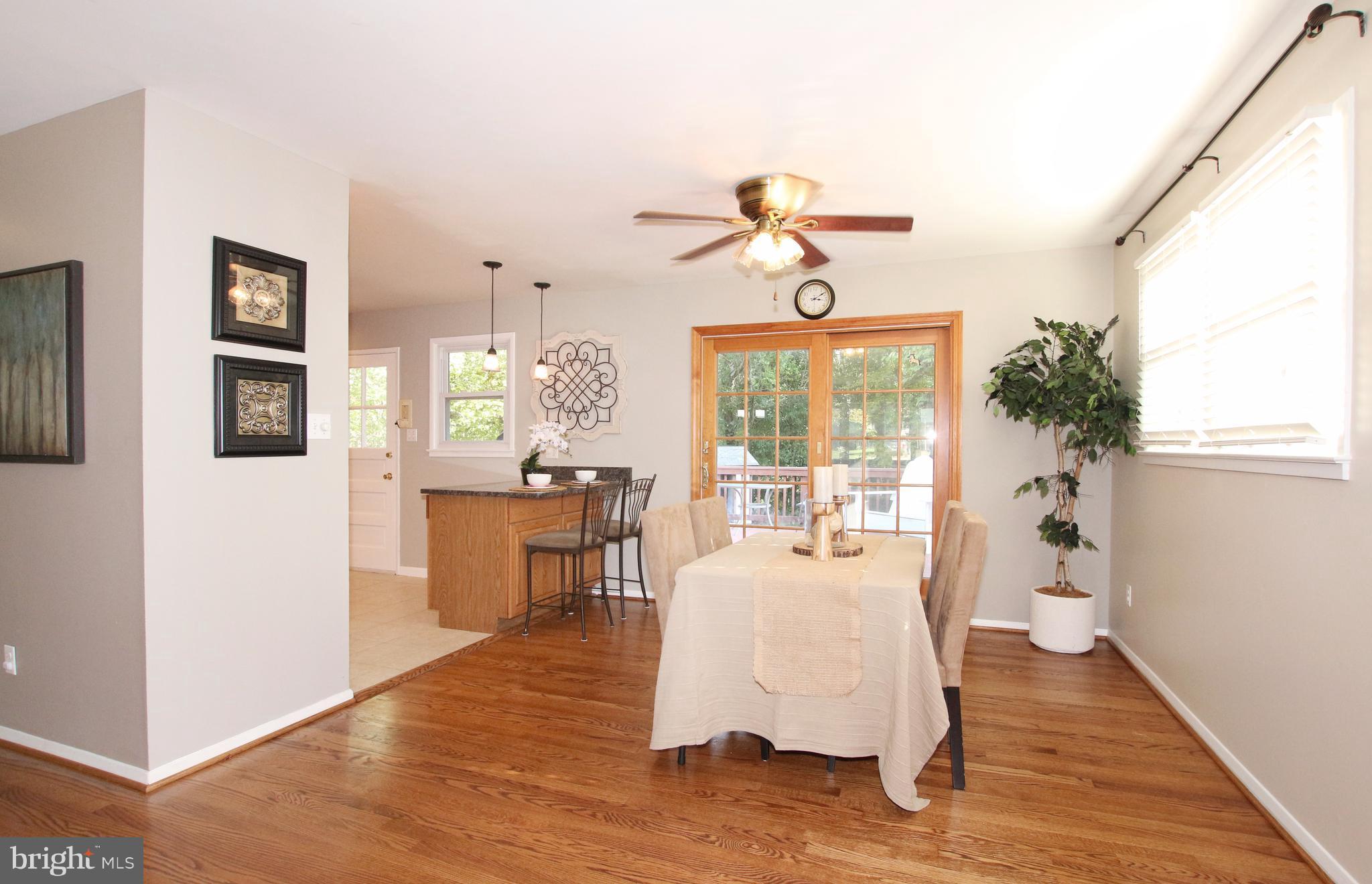 5300 Ravensworth Road Springfield, VA 22151 - Photo 8 of 28 a living room with furniture wooden floor and a large window