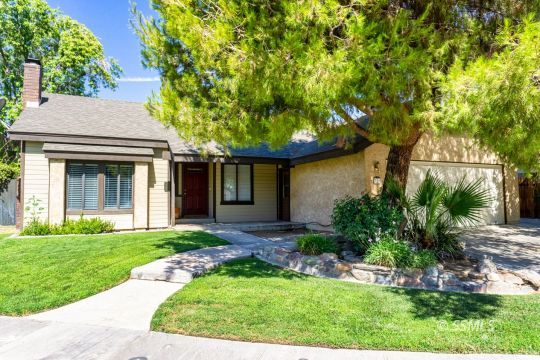 316 Mesquite Avenue Ridgecrest, CA 93555 - Photo 1 of 38 a front view of a house with garden
