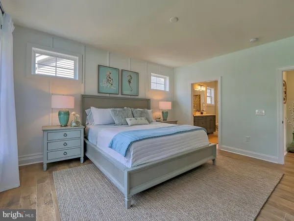 a bedroom with a bed and a night stand