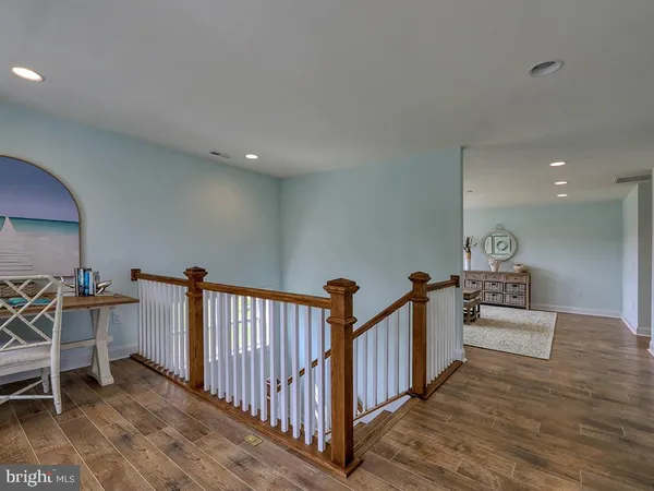 a view of a hallway with seating area