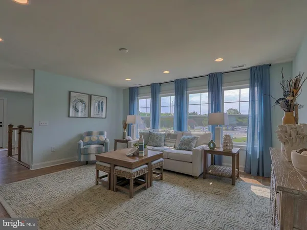 a living room with furniture and a table