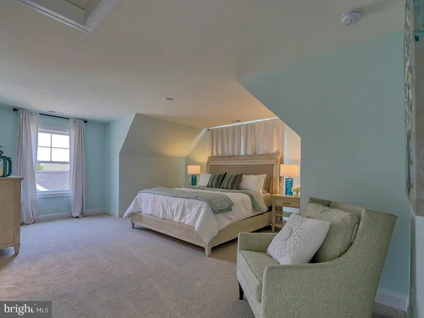 a bedroom with bed and window