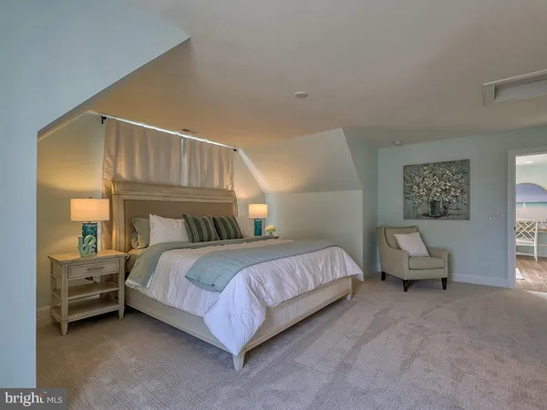 a bedroom with a bed and a couch