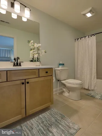 a room with a sink and cabinets