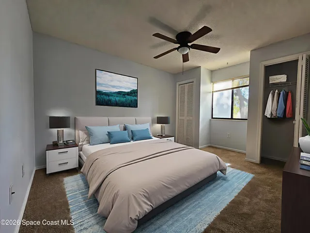 a bedroom with bed and window