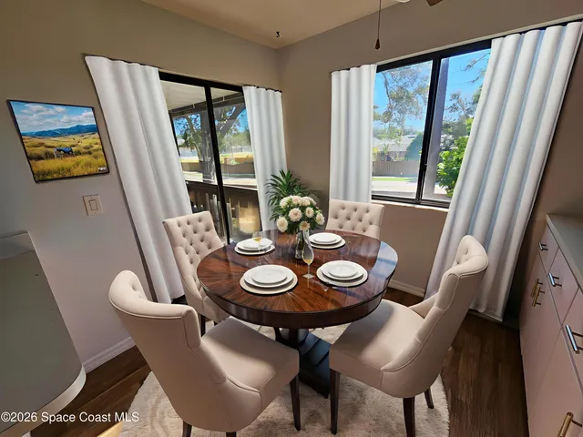 a view of a dining room with furniture window and outside view