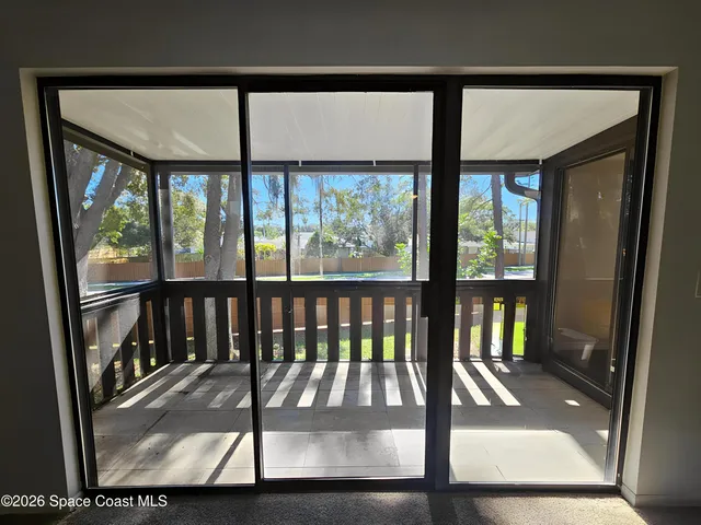 a view of a porch with a floor to ceiling window