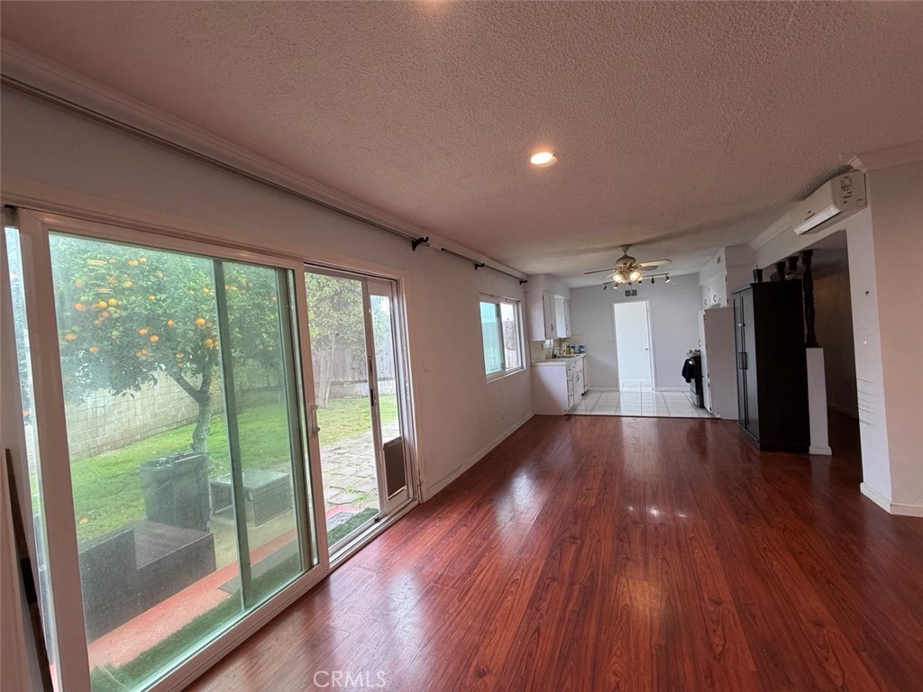 22706 Rashdall Avenue Carson, CA 90745 - Photo 11 of 32 a view of an empty room with wooden floor and a window