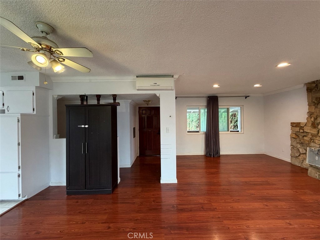 22706 Rashdall Avenue Carson, CA 90745 - Photo 8 of 32 an empty room with wooden floor and windows