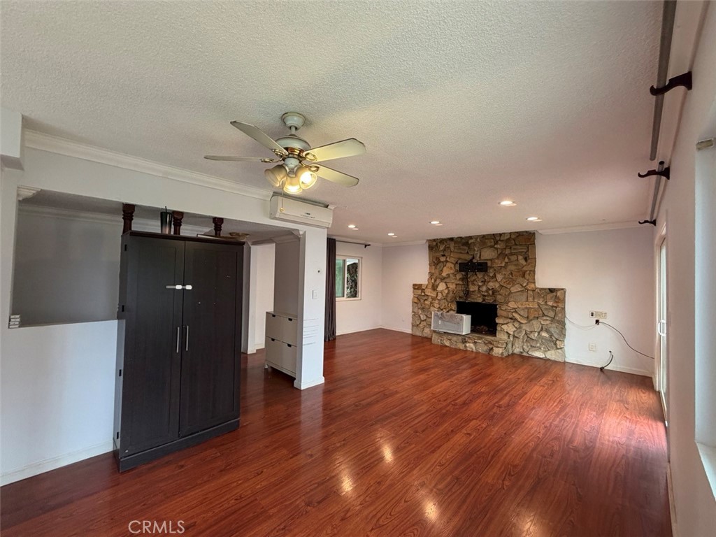 22706 Rashdall Avenue Carson, CA 90745 - Photo 10 of 32 a view of an empty room with wooden floor and a kitchen