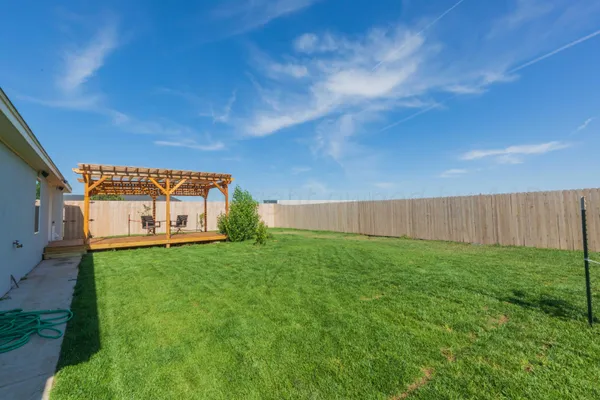 a view of a backyard with garden