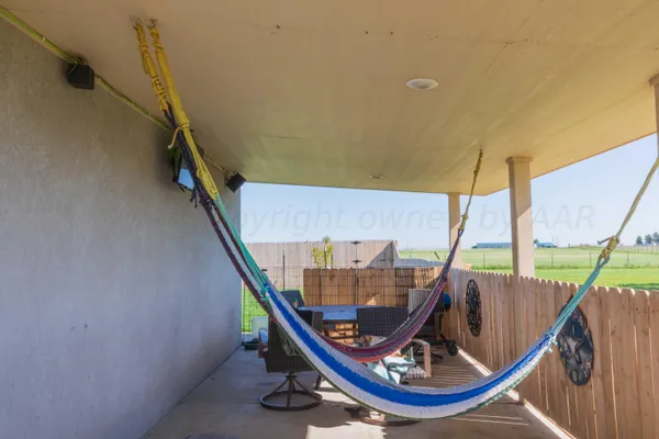 a view of deck with a table and chairs