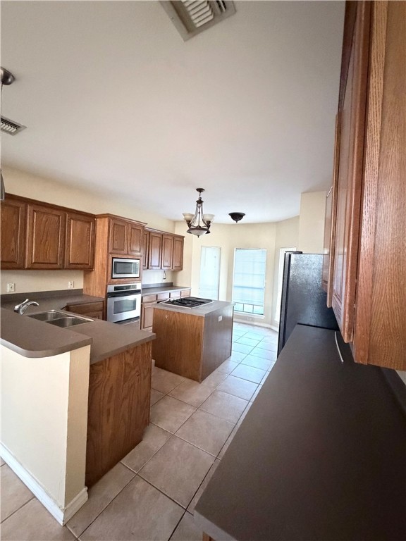 5214 Spring Brook Drive Corpus Christi, TX 78413 - Photo 4 of 12 a living room with stainless steel appliances furniture a rug and a kitchen view