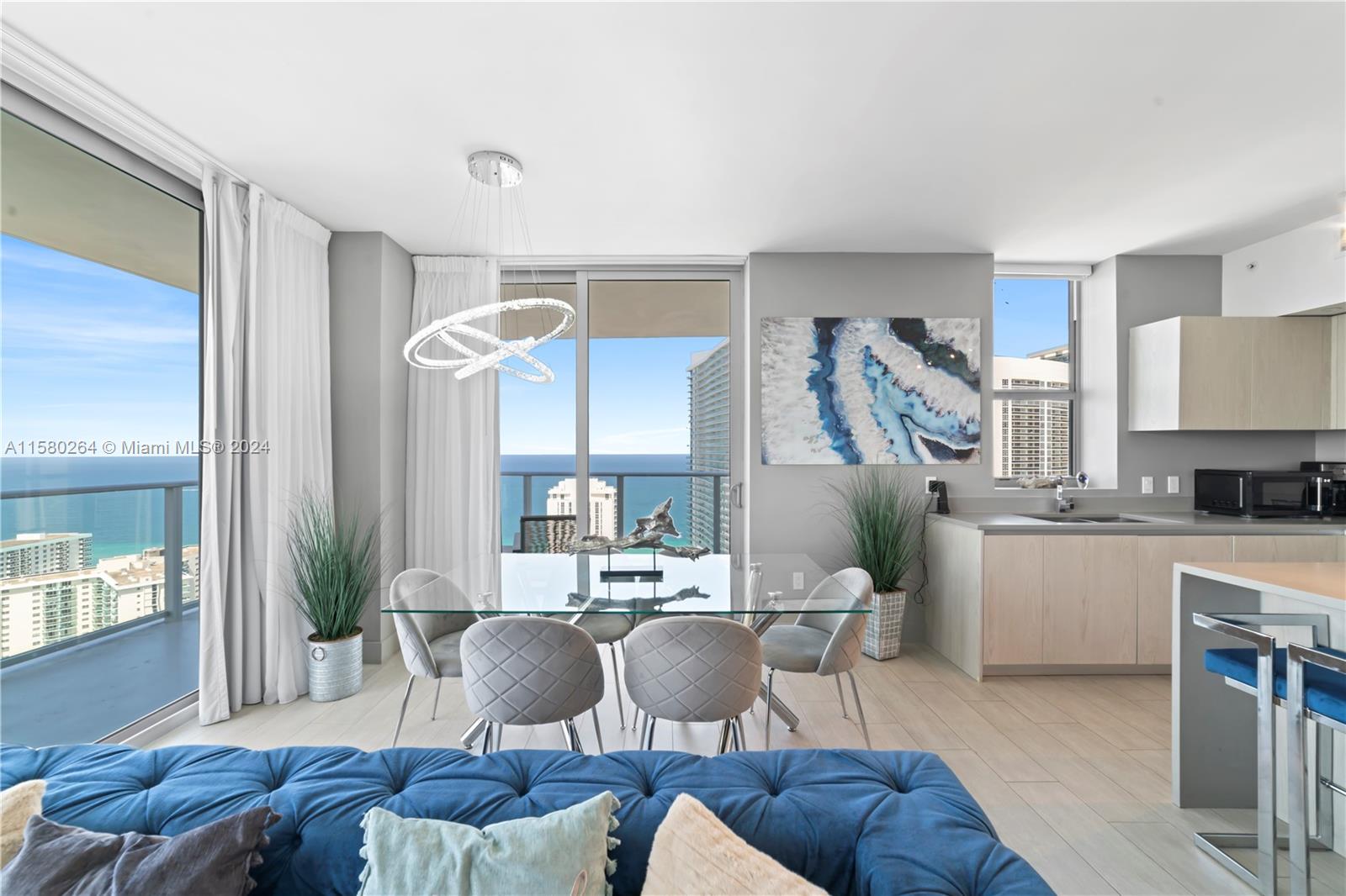 4010 South Ocean Drive, Unit R3001 Hollywood, FL 33019 - Photo 11 of 44 a living room with furniture and a large window