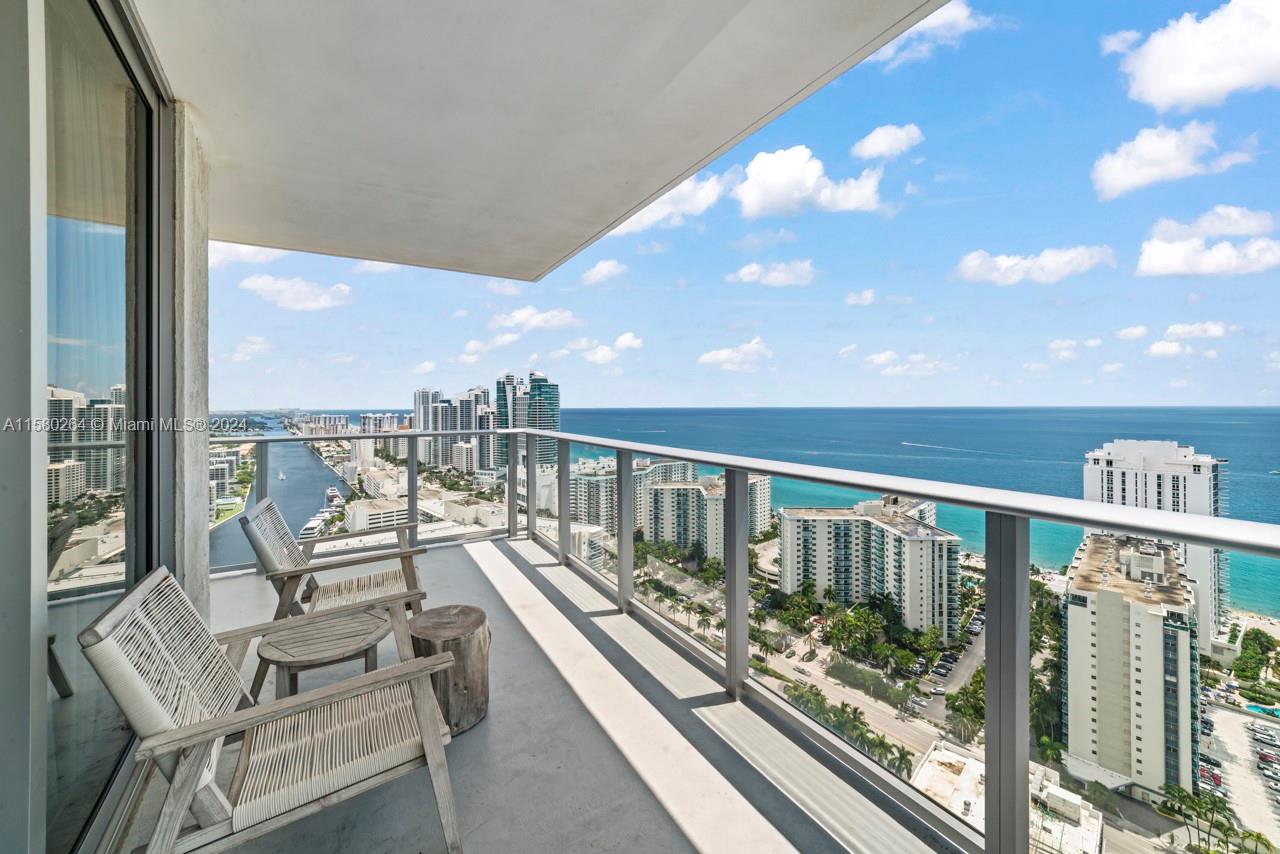 4010 South Ocean Drive, Unit R3001 Hollywood, FL 33019 - Photo 26 of 44 a balcony with chairs