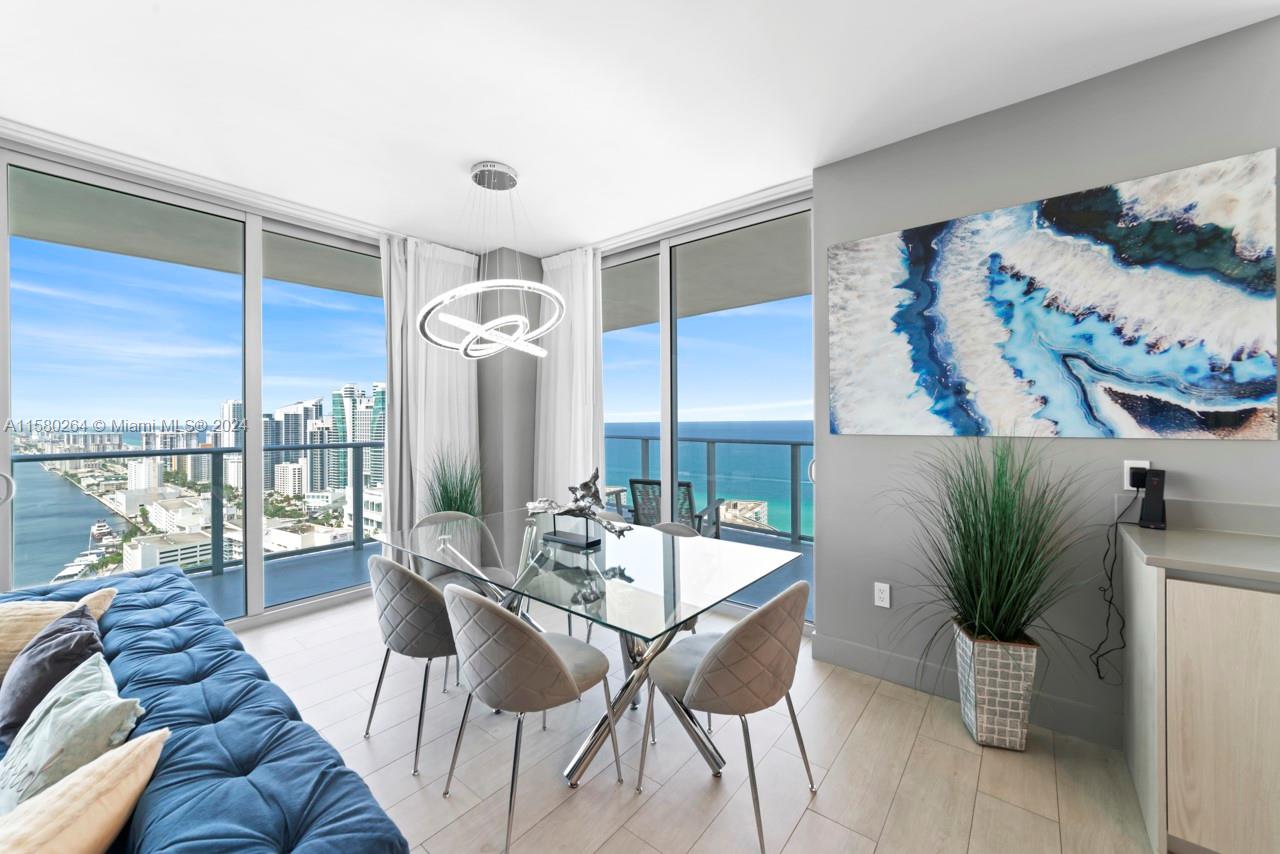 4010 South Ocean Drive, Unit R3001 Hollywood, FL 33019 - Photo 35 of 44 a living room with furniture and a large window