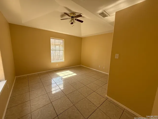 a view of empty room with windows