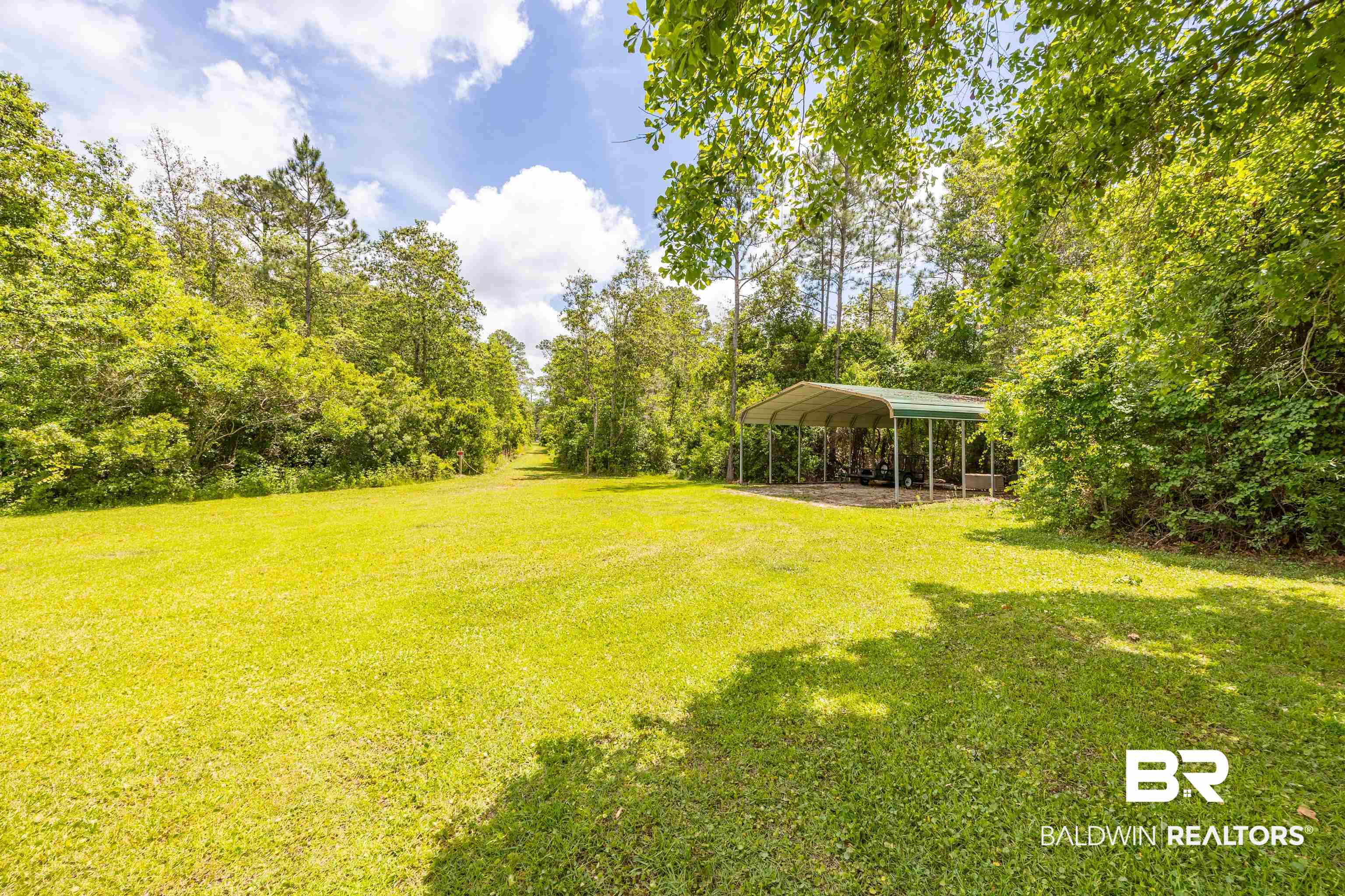 9771 Clarke Ridge Road Foley, AL 36535 - Photo 6 of 72 View of yard with a detached carport.