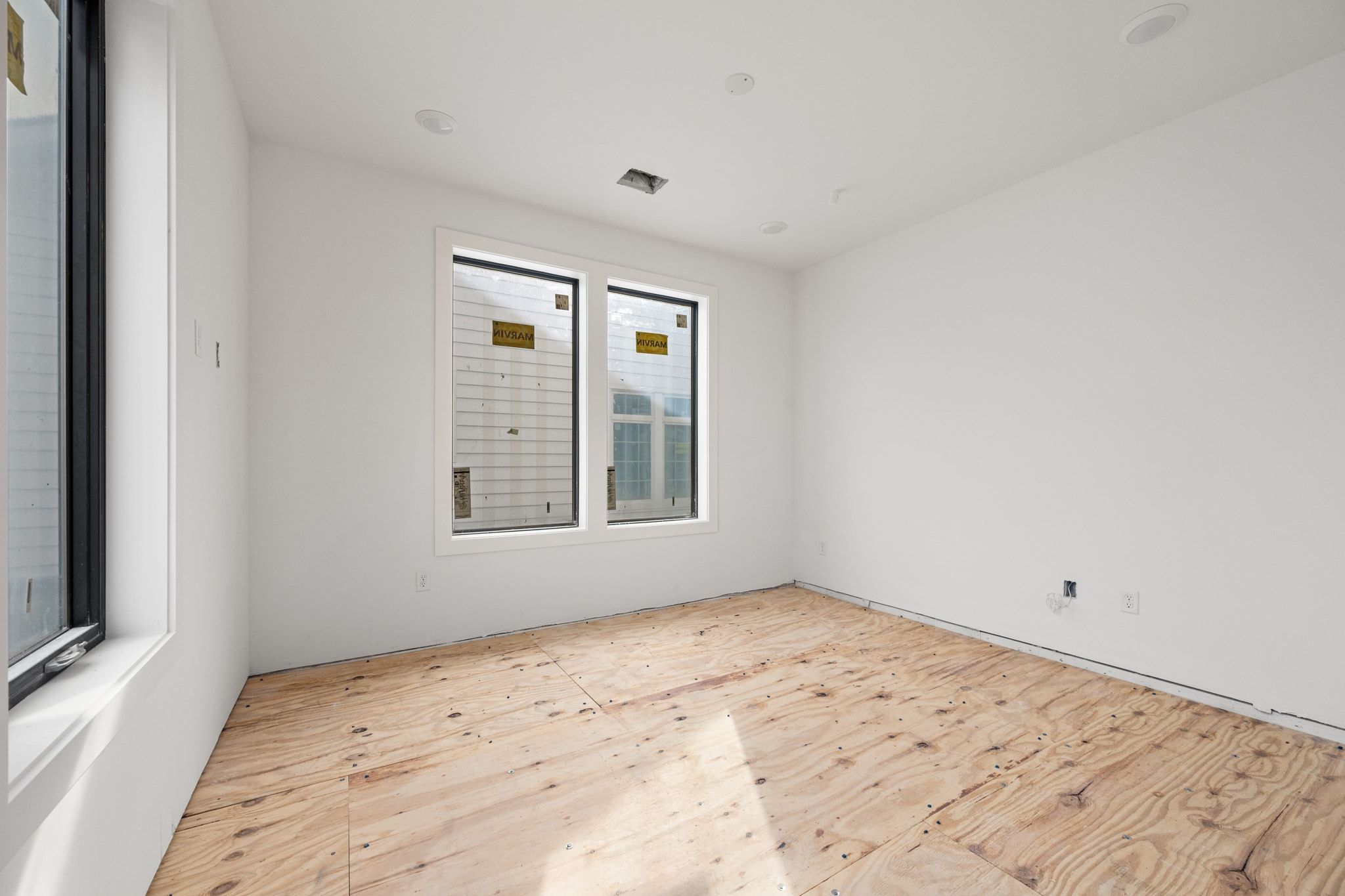 1408 West 9th Street, Unit 801 Austin, TX 78703 - Photo 8 of 18 a view of empty room with wooden floor and fan