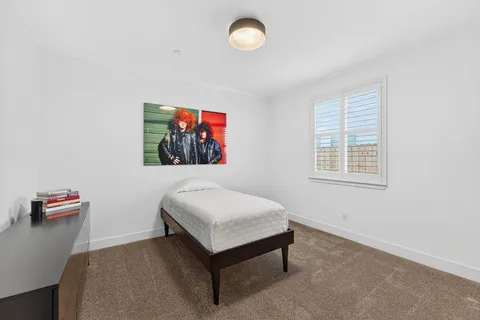 a room with a bed and a window