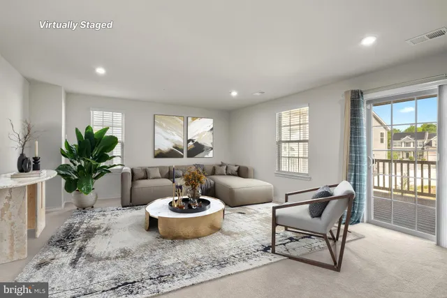 a living room with furniture and windows