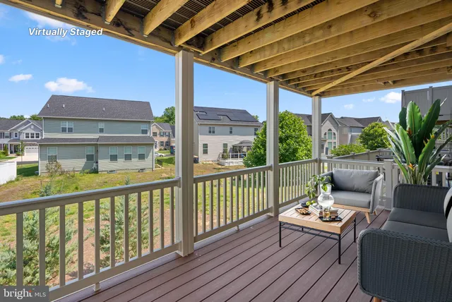 a view of a balcony with furniture