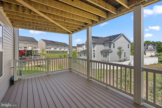 a view of a porch with wooden floor