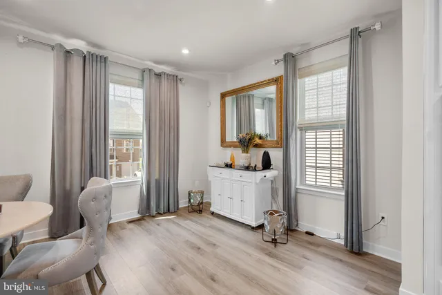 a view of a livingroom with furniture and a window