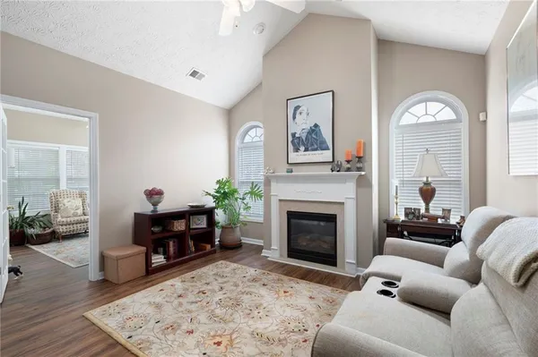 a living room with furniture and a fireplace