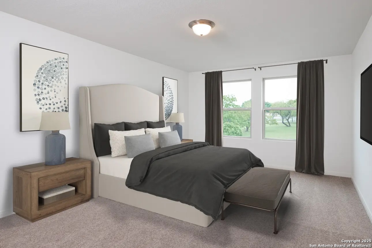 12827 Prairie Valley Schertz, TX 78154 - Photo 6 of 13 a living room with a bed furniture and a window