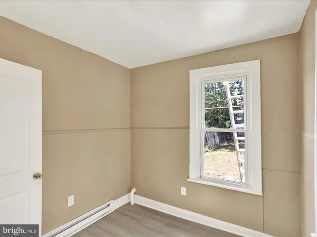a view of a room that has a window in it