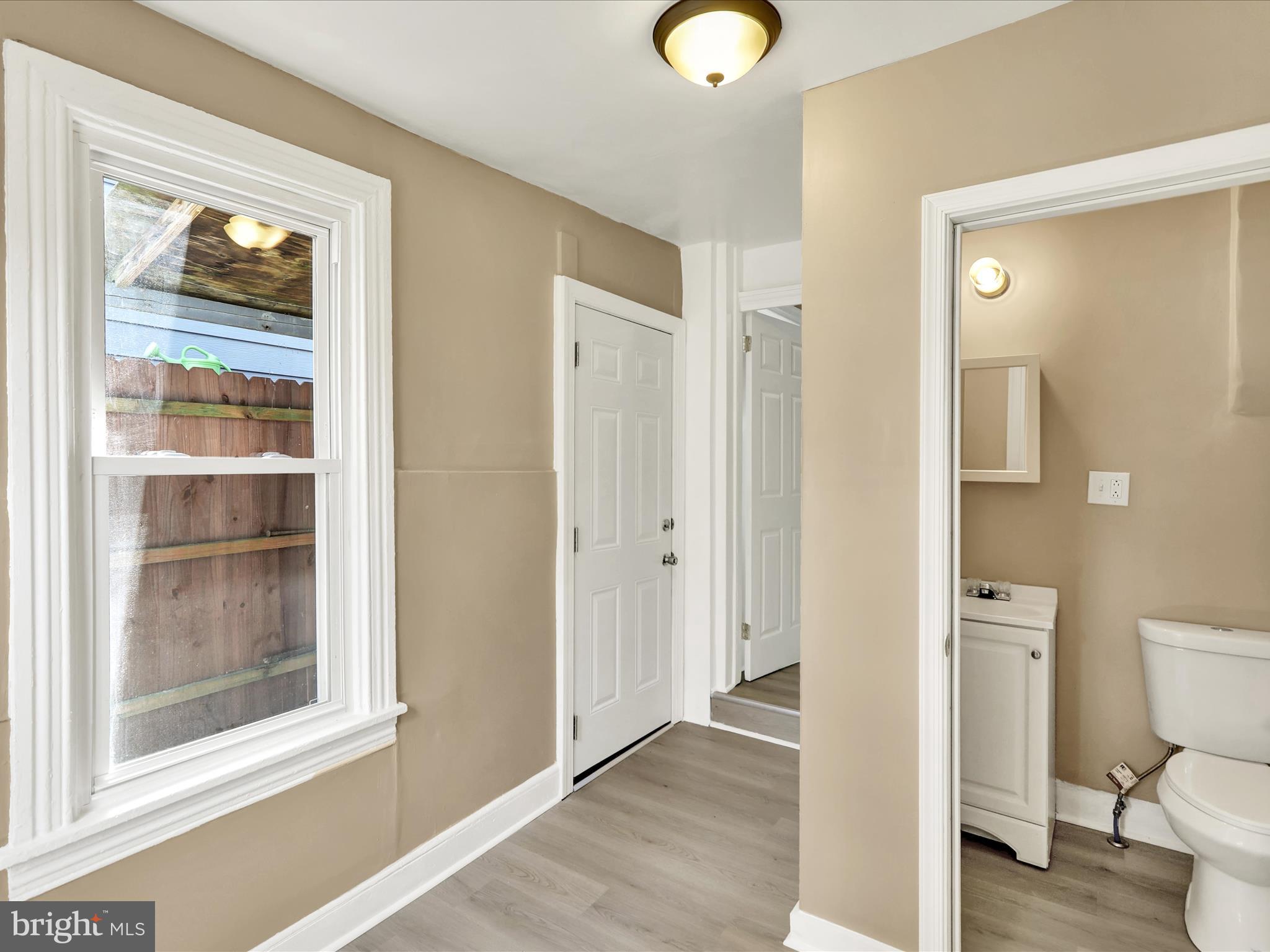 541 South 11th Street Reading, PA 19602 - Photo 12 of 24 a bathroom with a toilet shower and a window