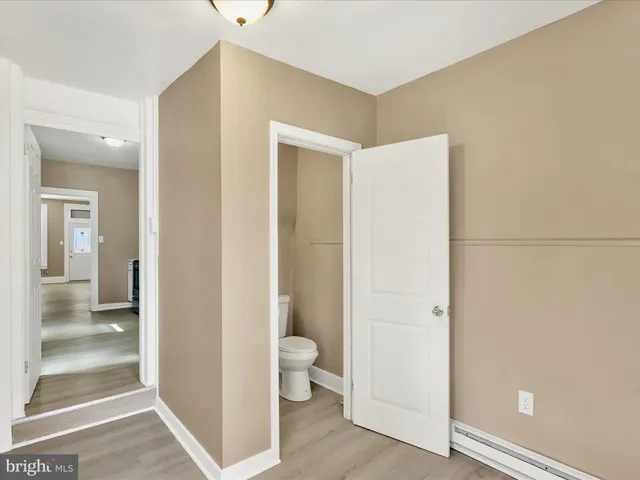 a view of a bathroom with toilet