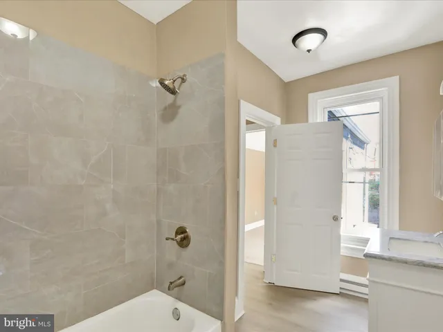 a bathroom with a shower and a toilet