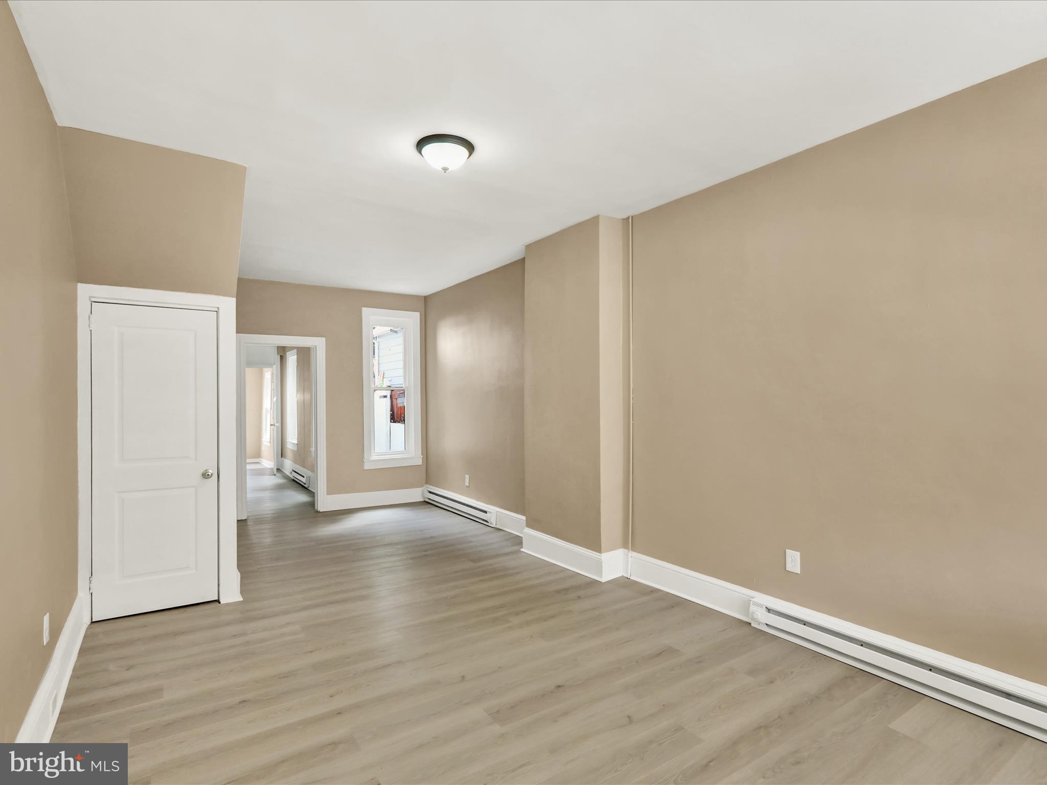 541 South 11th Street Reading, PA 19602 - Photo 5 of 24 a view of an empty room with wooden floor