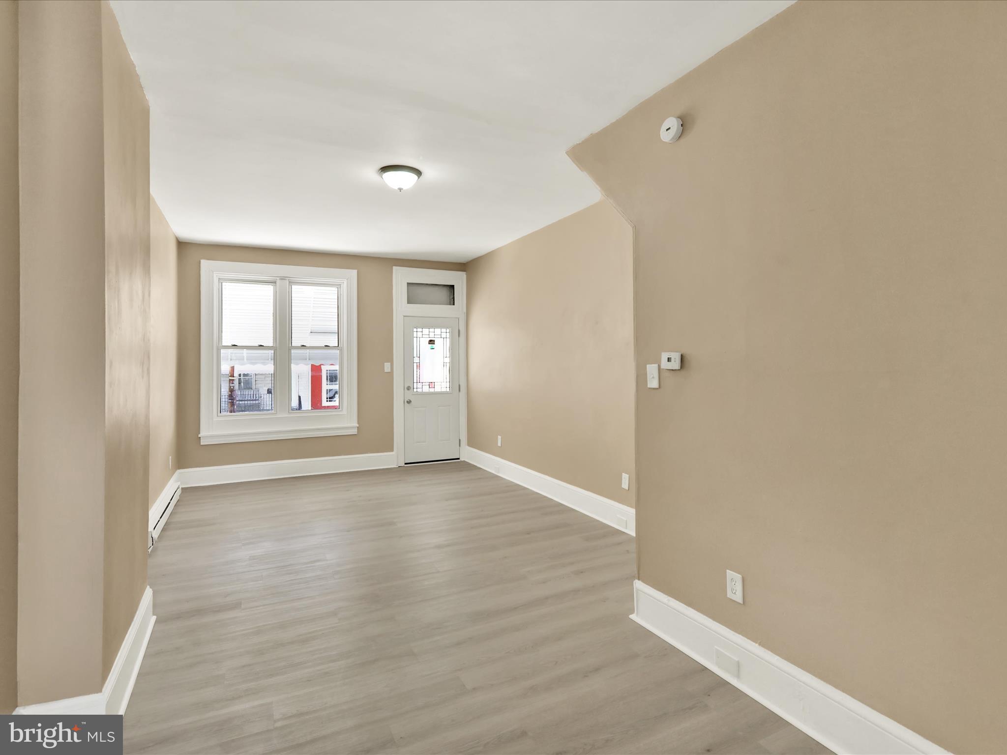 541 South 11th Street Reading, PA 19602 - Photo 7 of 24 wooden floor in an empty room with a window