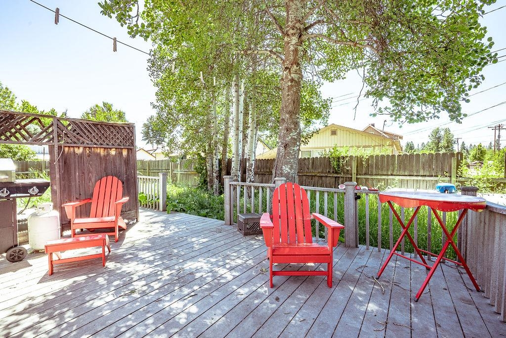470 Riverside Avenue Chester, CA 96020 - Photo 20 of 25 an outdoor sitting area with couch and wooden fence