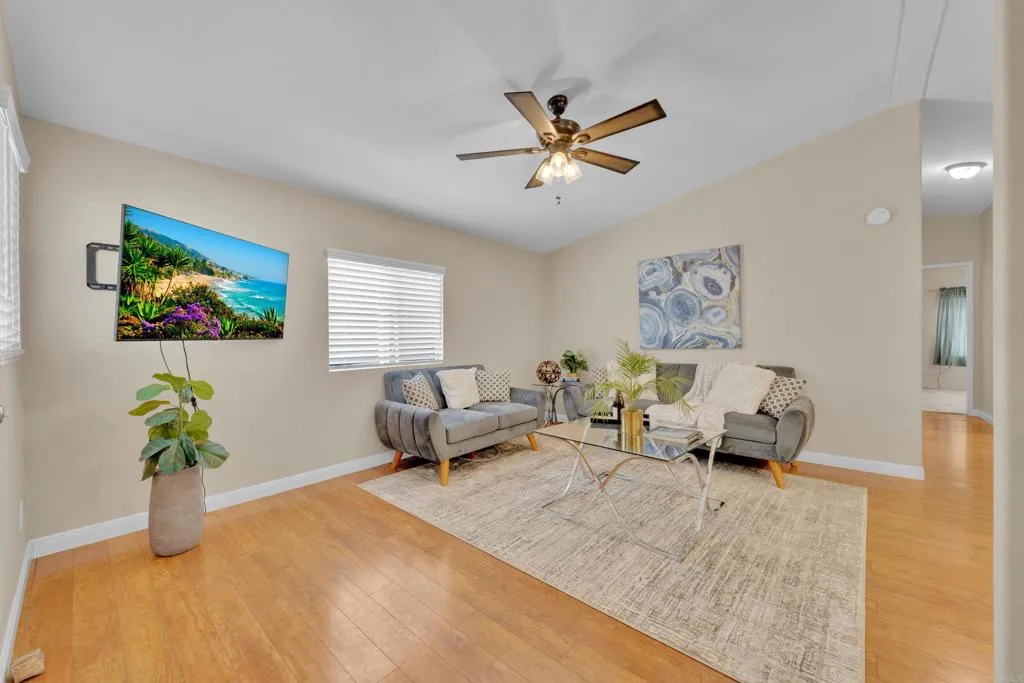 1815 Sweetwater Road, Unit 169 Spring Valley, CA 91977 - Photo 11 of 50 a living room with furniture stairs and a window