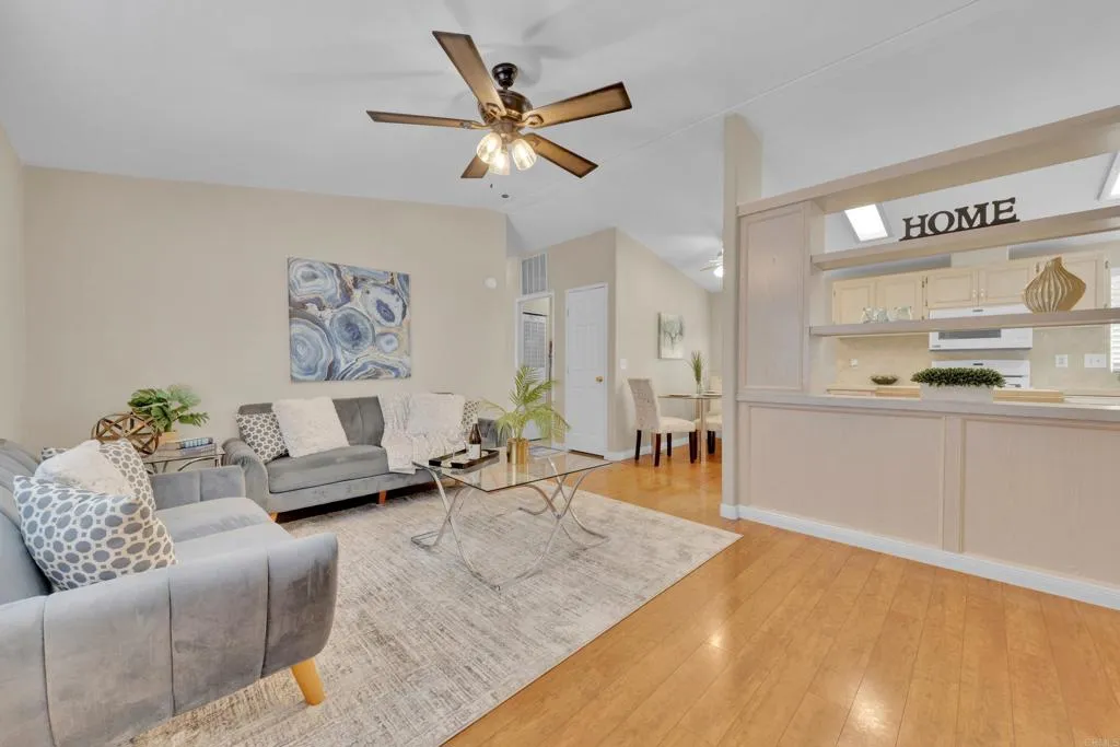 1815 Sweetwater Road, Unit 169 Spring Valley, CA 91977 - Photo 14 of 50 a living room with furniture and a wooden floor