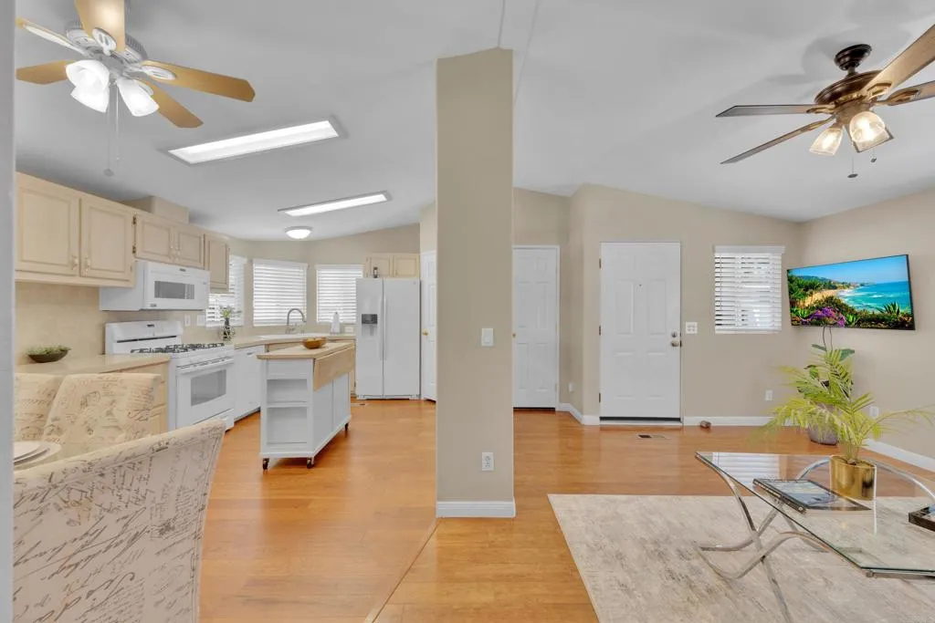 1815 Sweetwater Road, Unit 169 Spring Valley, CA 91977 - Photo 16 of 50 a living room with stainless steel appliances kitchen island granite countertop furniture and a view of kitchen