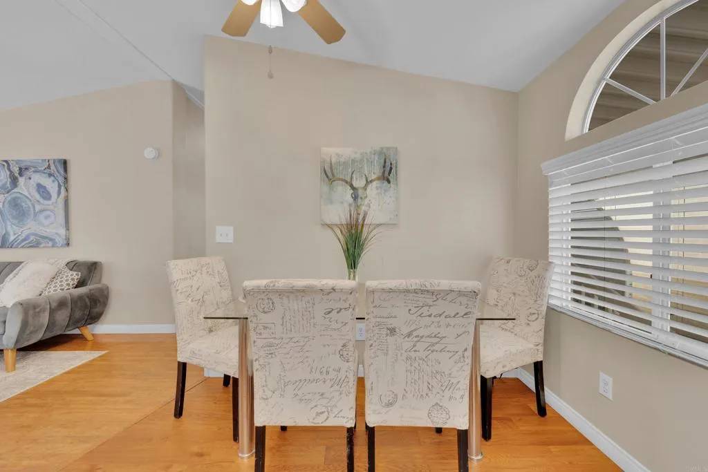 1815 Sweetwater Road, Unit 169 Spring Valley, CA 91977 - Photo 17 of 50 a view of a dining room with furniture and wooden floor