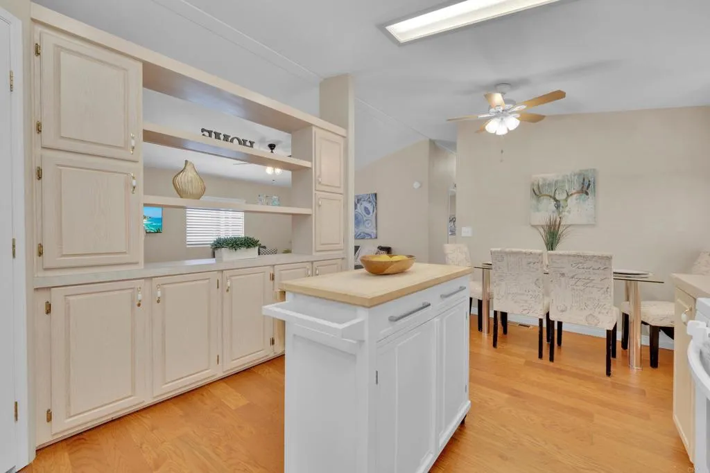 1815 Sweetwater Road, Unit 169 Spring Valley, CA 91977 - Photo 20 of 50 a kitchen with cabinets and wooden floor