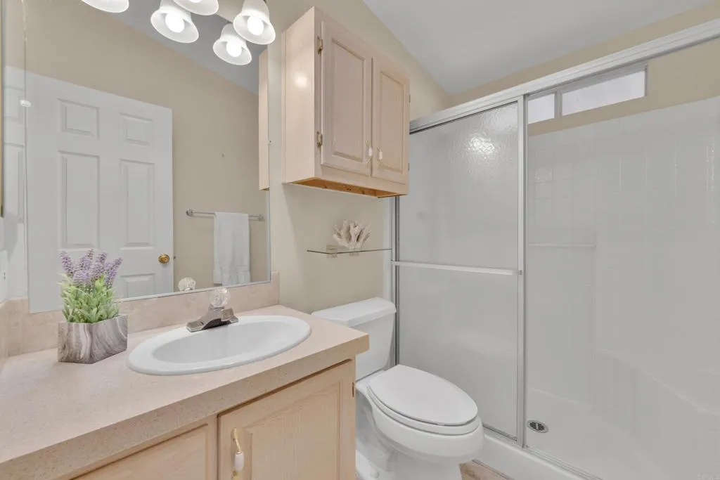 1815 Sweetwater Road, Unit 169 Spring Valley, CA 91977 - Photo 30 of 50 a bathroom with a sink toilet and shower