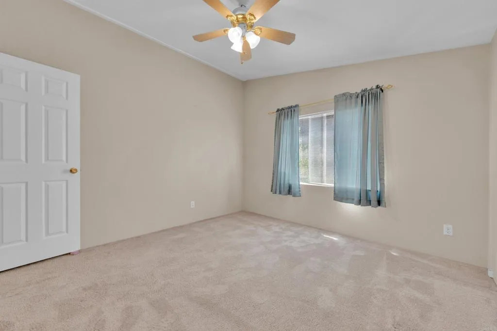 1815 Sweetwater Road, Unit 169 Spring Valley, CA 91977 - Photo 34 of 50 an empty room with windows and fan