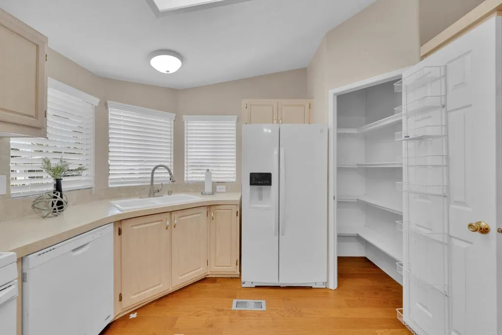 1815 Sweetwater Road, Unit 169 Spring Valley, CA 91977 - Photo 37 of 50 a kitchen with a sink cabinets and a window